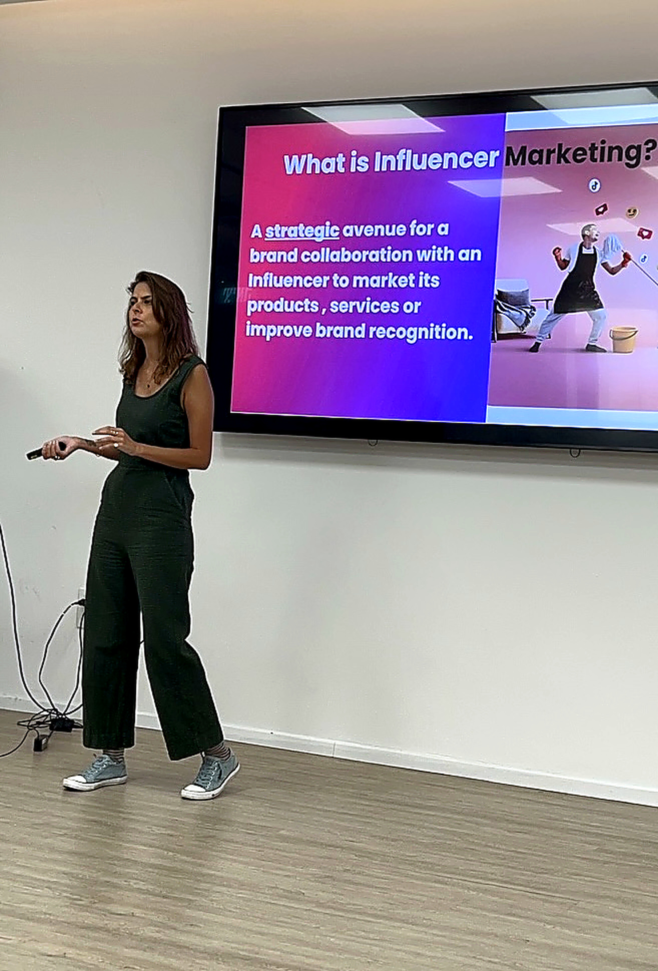 Adi teaching a marketing workshop